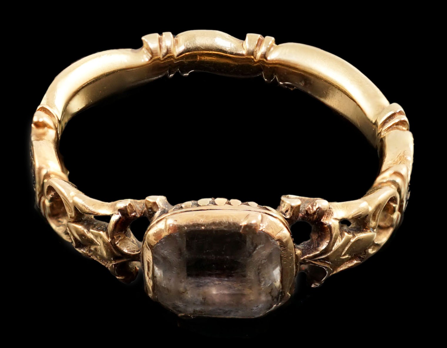 A George II gold, black enamel and rock crystal set mourning ring